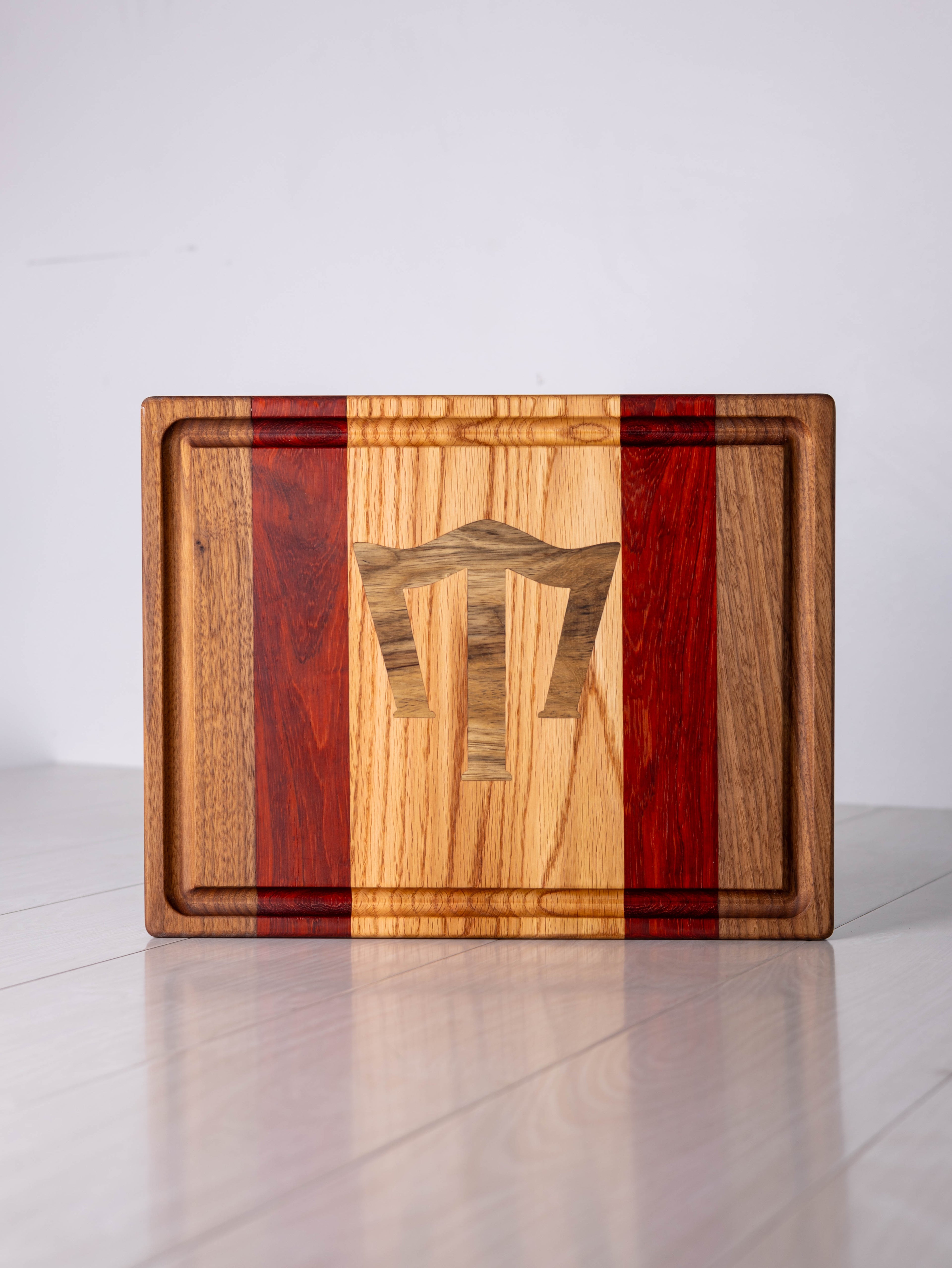 Walnut/Padauk/Ash w/ Black Limba inlay Cutting Board