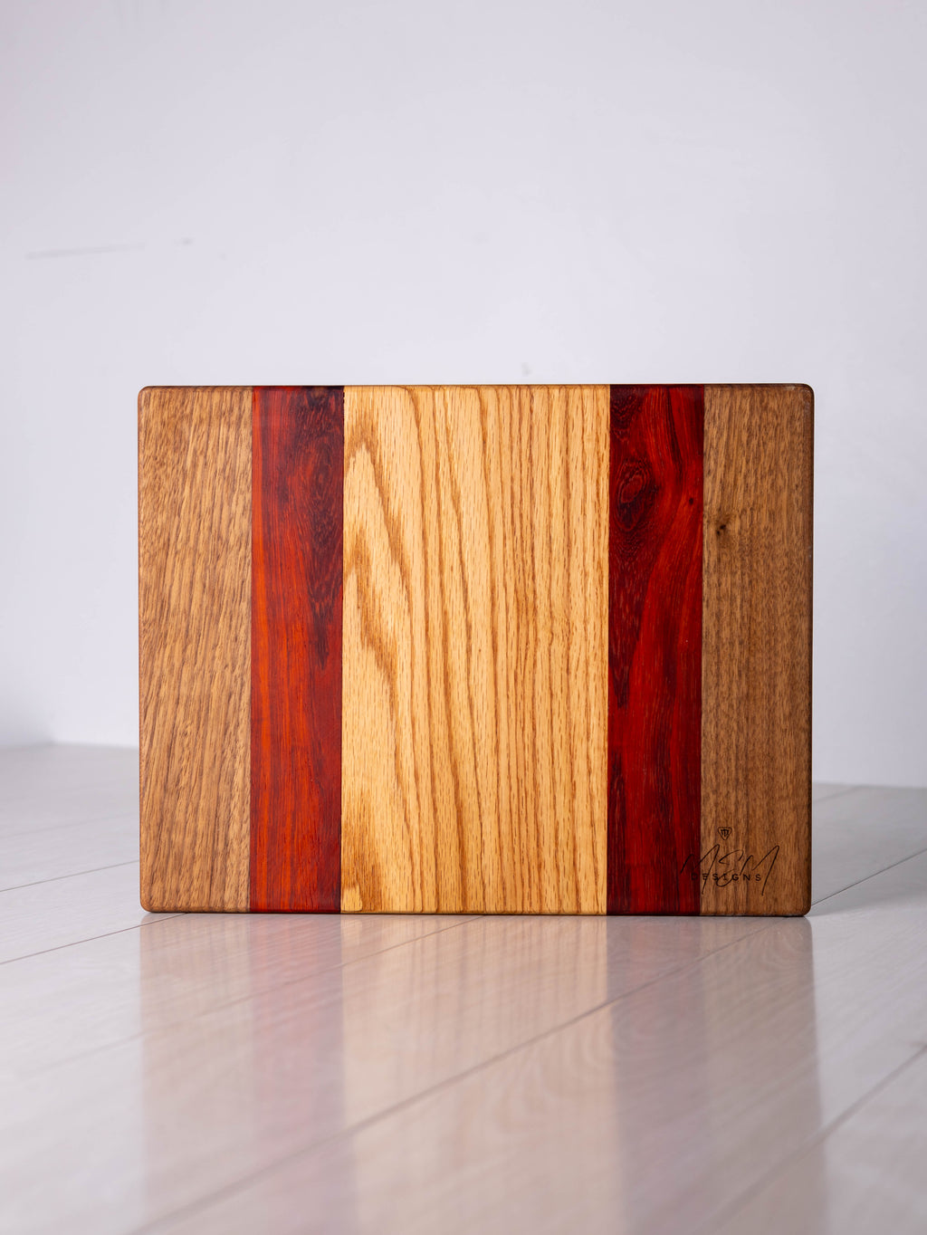 Walnut/Padauk/Ash w/ Black Limba inlay Cutting Board