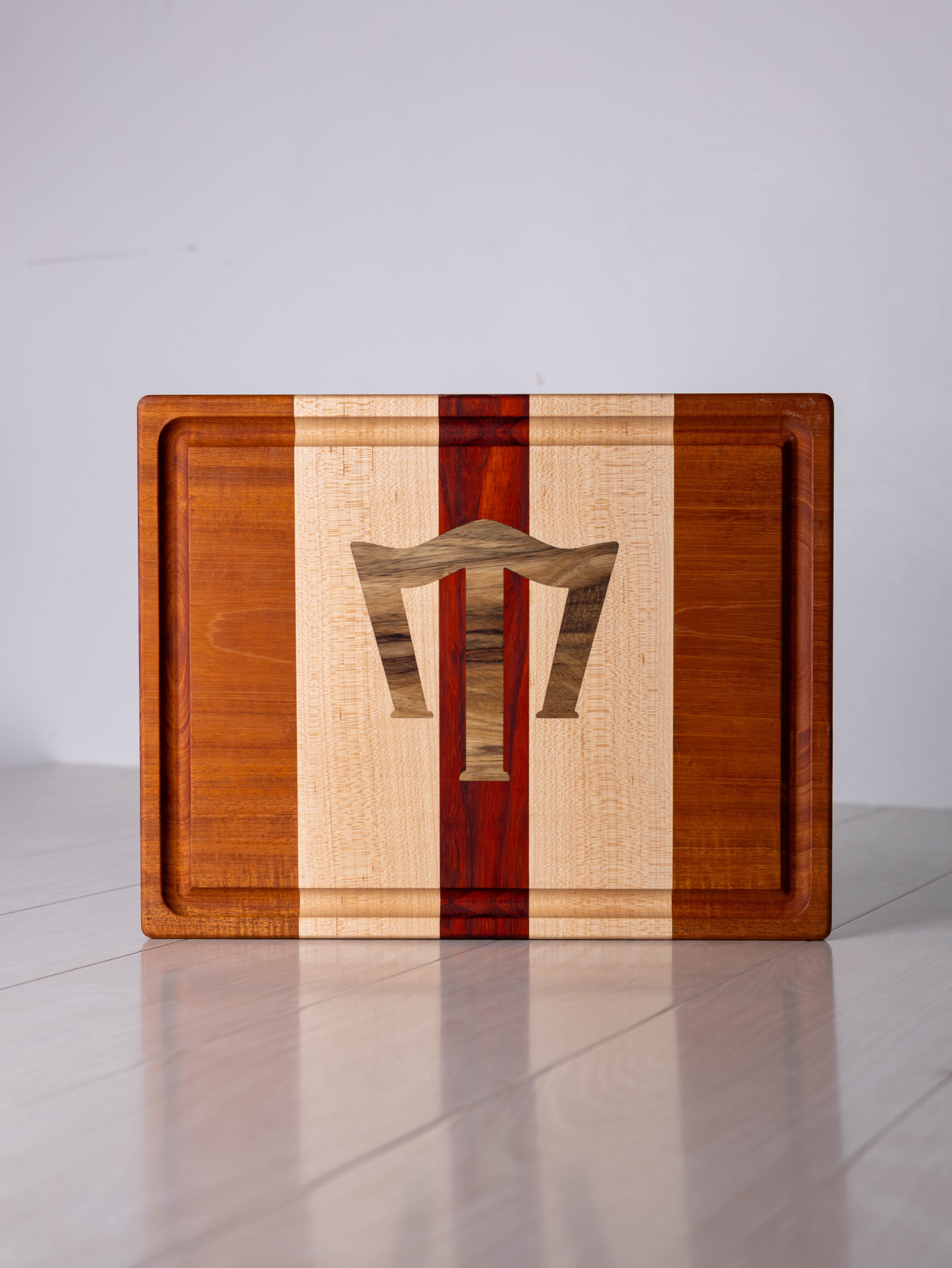 Mahogany/Maple/Padauk w/ Black Limba inlay Cutting Board