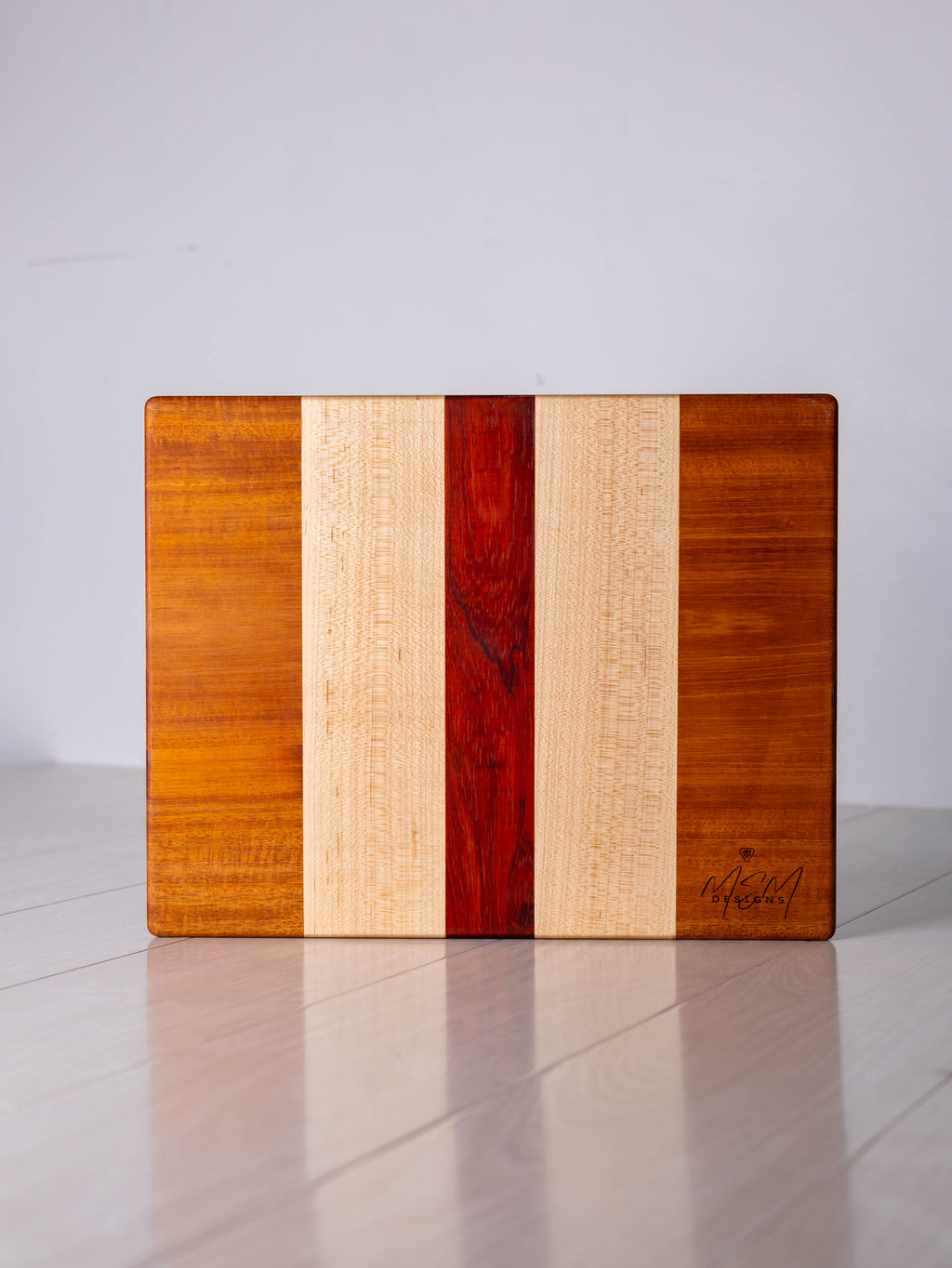 Mahogany/Maple/Padauk w/ Black Limba inlay Cutting Board